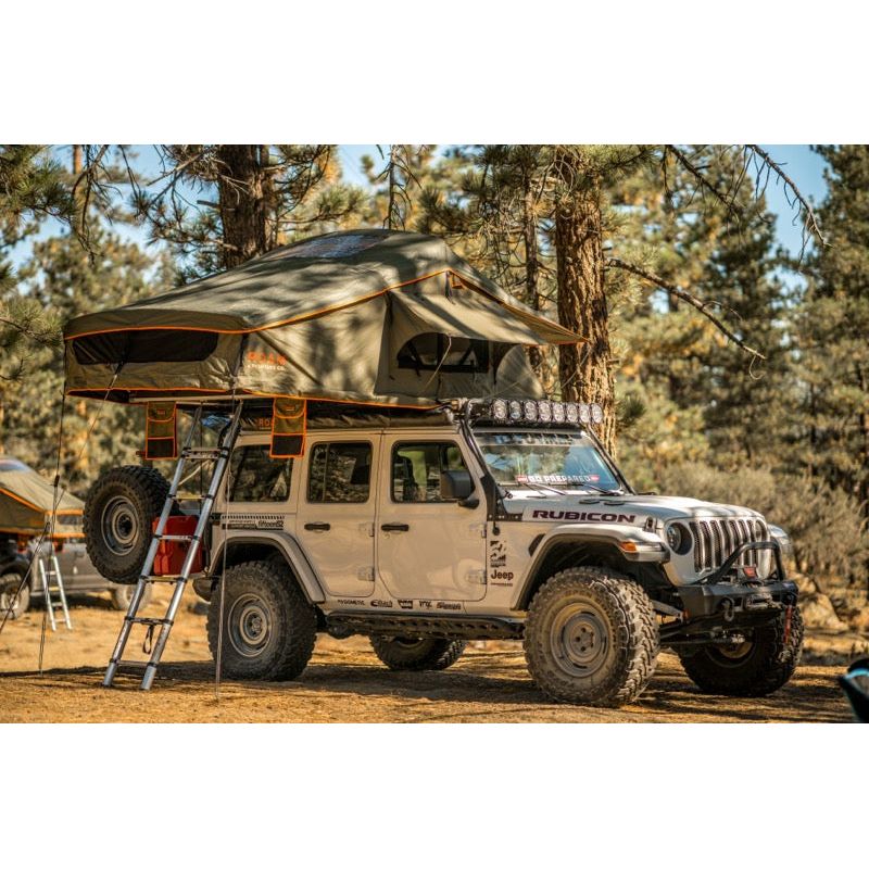 Vagabond XL Rooftop Tent in Forest Green Hyper Orange with telescopic ladder on a Jeep Rubicon