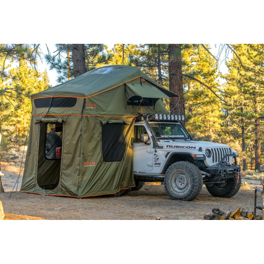 Vagabond XL Rooftop Tent in Forest Green with Annex Room shown on a Jeep Rubicon